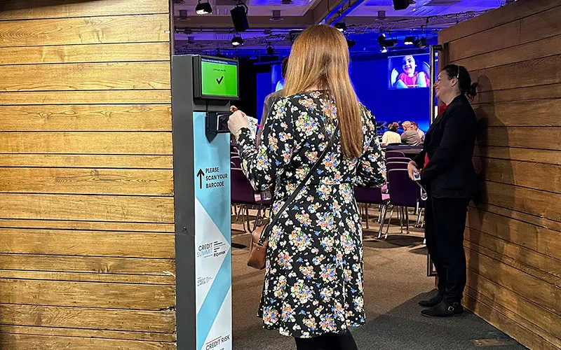 Scanning a badge at a ScanPod at entrance to meeting room
