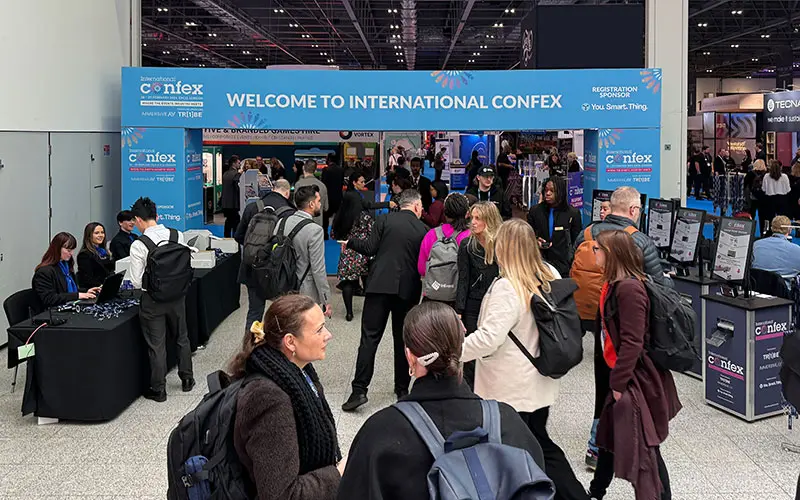 Exhibition entrance with good signage, manned registration desks and self-service Printpods
