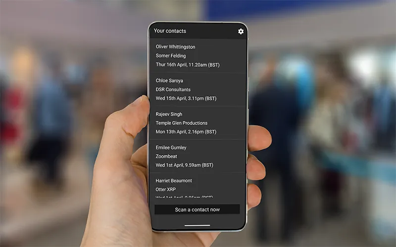 A smartphone displaying the contact details a person has collected from scanning badges through the ContactScanning app.