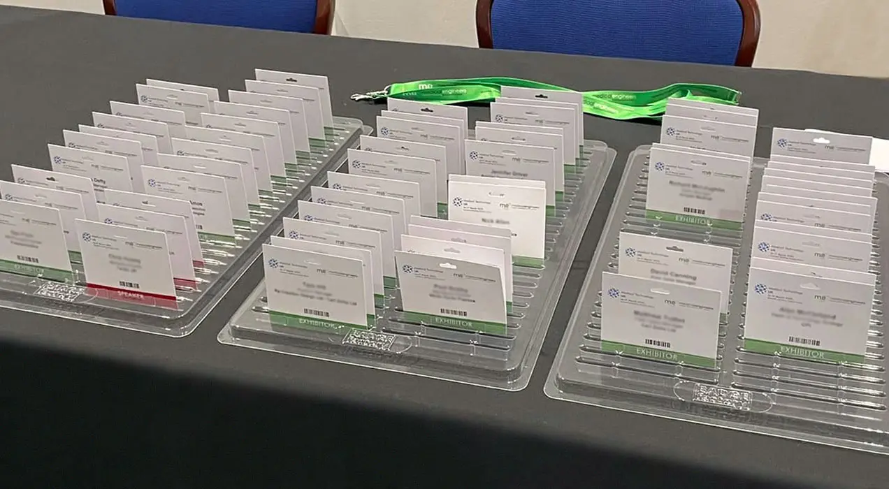 Badges ready to collect with lanyards