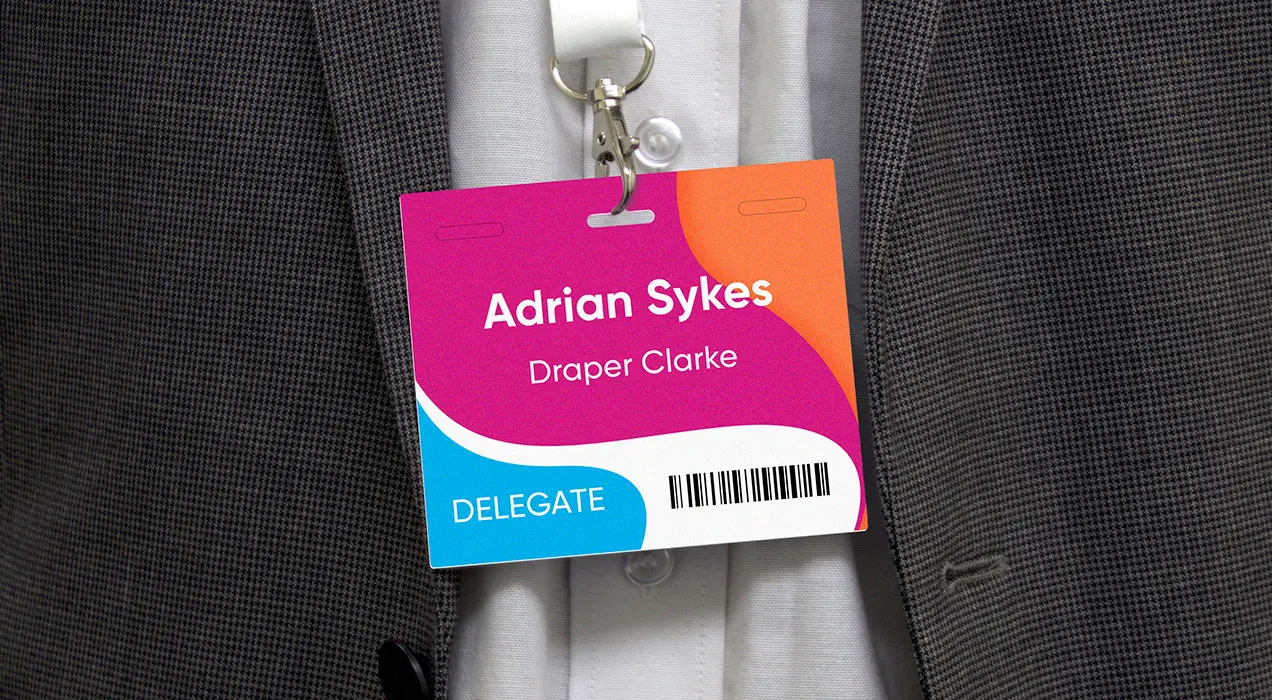 Person wearing a badge on a lanyard