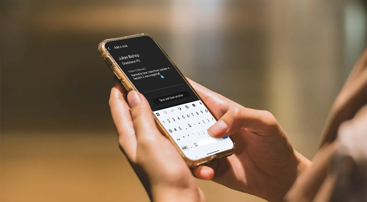 Person typing a note into the ContactScanning app on their smartphone