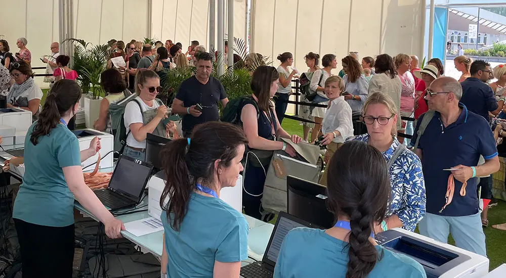 people using badging stations