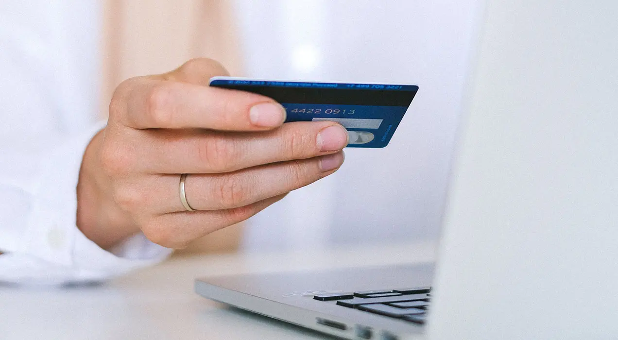 Person holding bank card