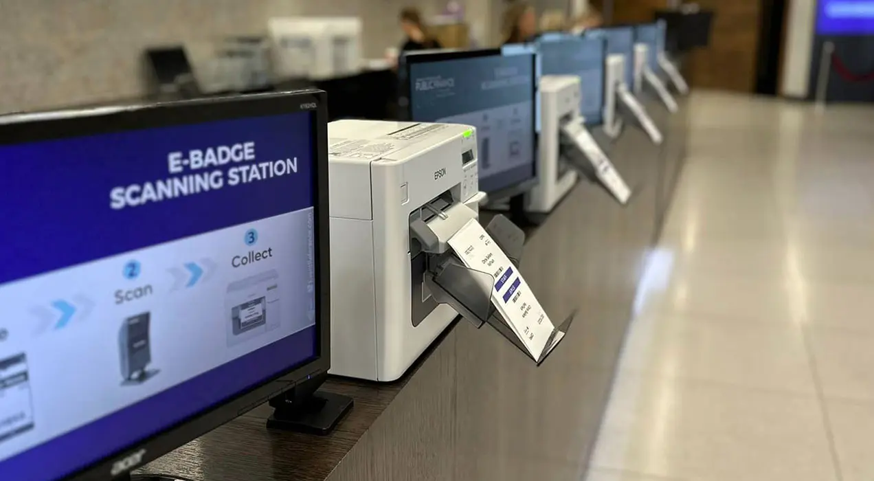 E-badge scanning and printing station
