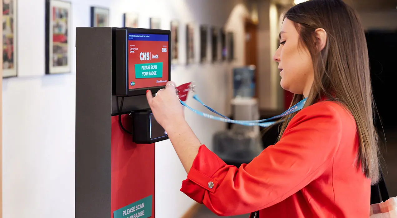 Person scanning their badge at a ScanPod