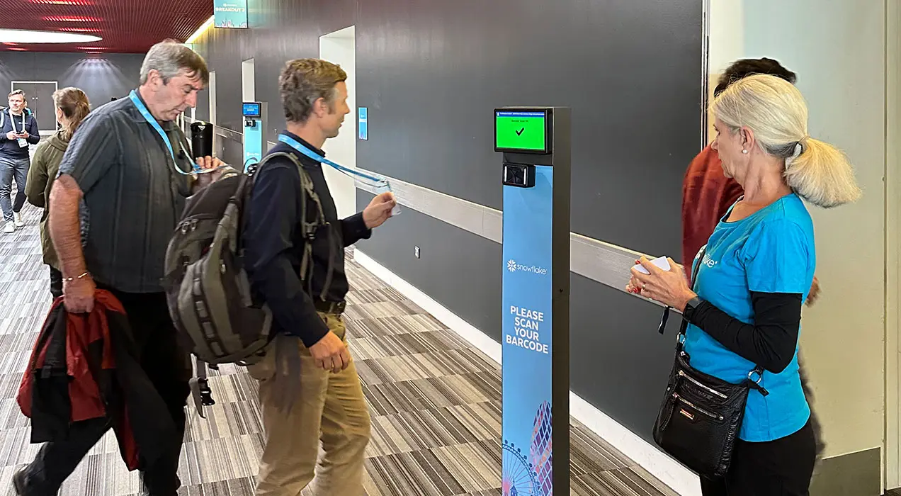 People scanning their badges at a ScanPod