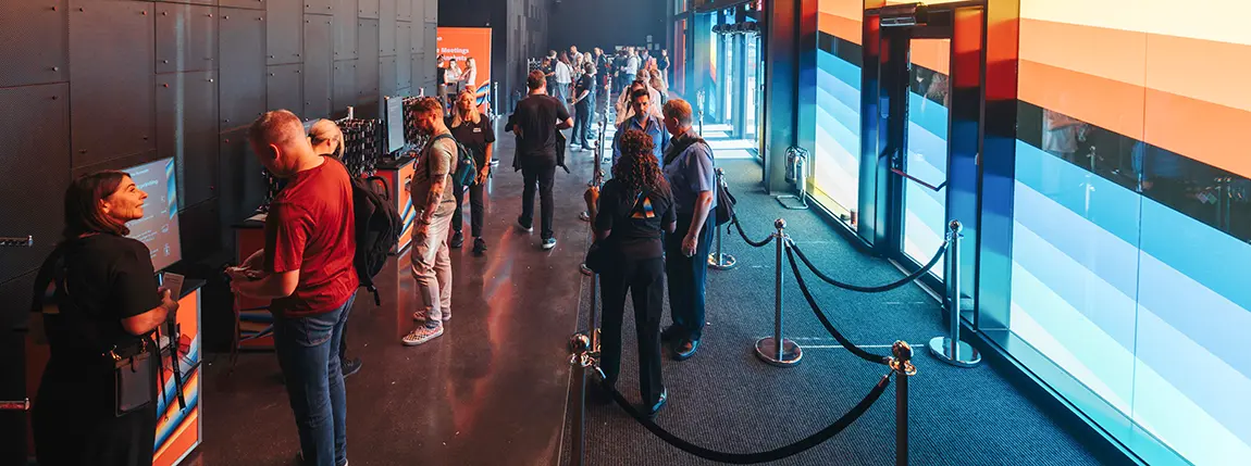 People using PrintPods in a colourful entrance foyer